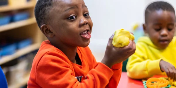 chatty toddler with playdough